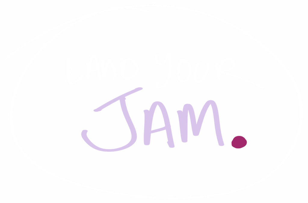 Handwritten text that reads ‘Land Your Jam.’ in white and light purple marker, with a dark pink period, encircled in white on a dark purple background.