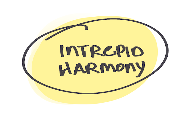 Handwritten text that reads “Intrepid Harmony” in black marker, encircled and layered over a soft yellow blob.