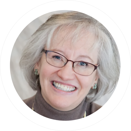 Photo of Sondra smiling.